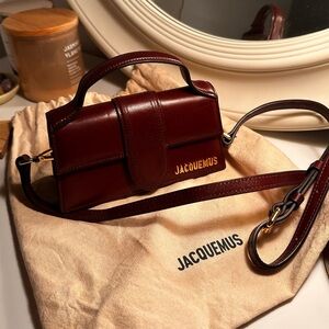 Jacquemus Le Bambino Leather Crossbody Bag in 'Brown'.